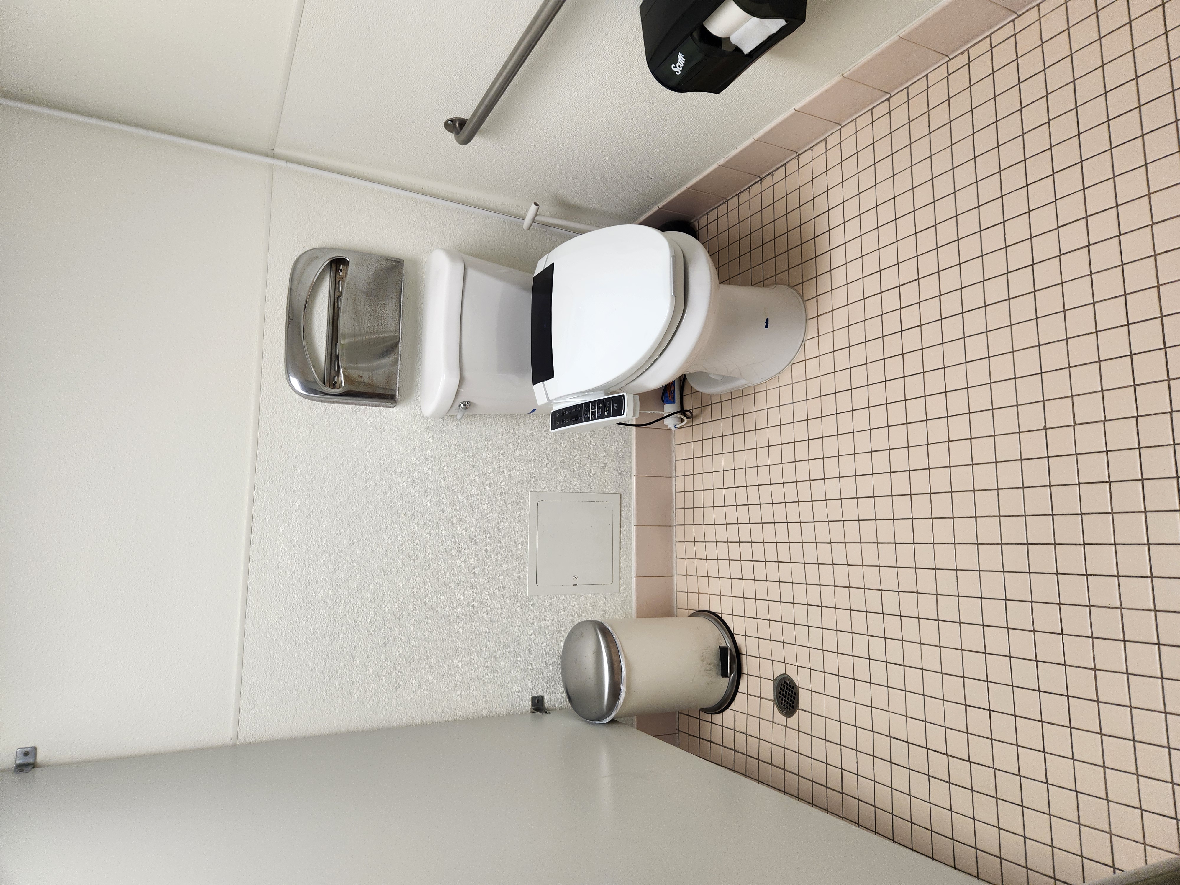 Office bathroom stall cleaned